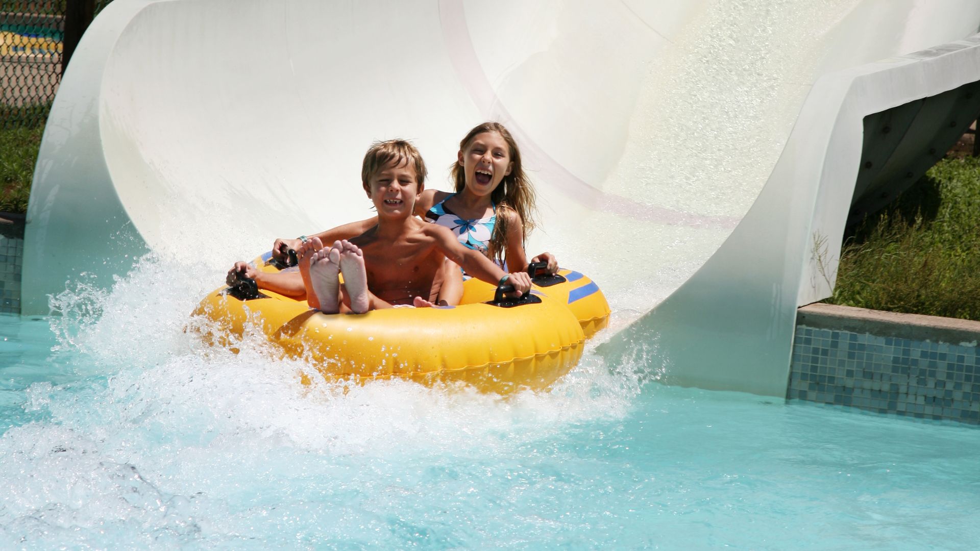 kids on waterslide at aqua park